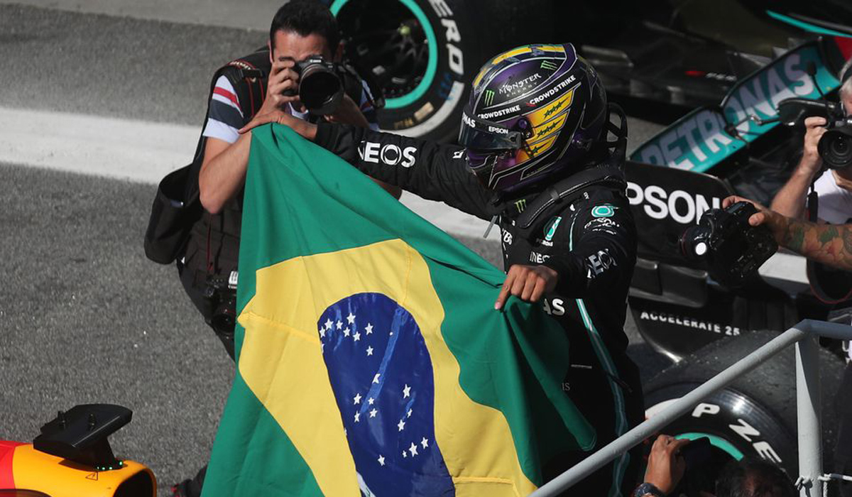 Lewis Hamilton celebrates winning the race
